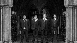 Groomsmen outside Christchurch priory