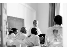 Bride gettning ready with her bridesmaids before the wedding ceremony